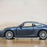 RMZ City 554010M Машина металлическая Porsche 911 Carrera S (2012), инерционная, темно-синий матовый цвет, 1:32